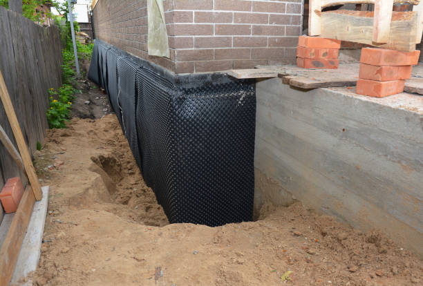 SJ Waterproofing Pros technician performing targeted Interior Drainage System assessment in New Richmond, OH